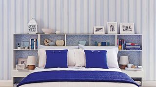 Bedroom with blue striped wallpaper to show key bedroom trend for decorating