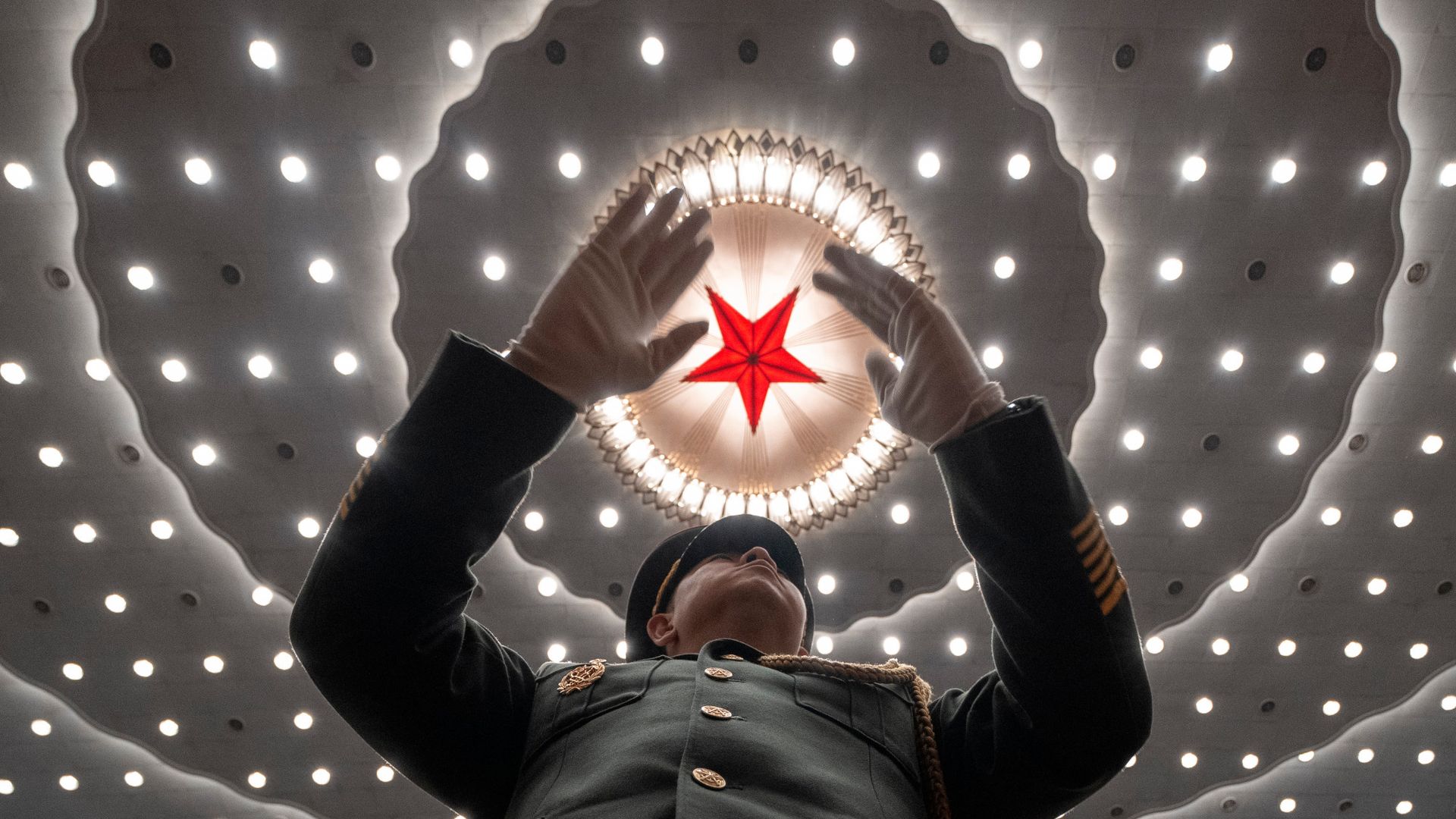 
                                A Chinese military band conductor performs during the National People&#039;s Congress in Beijing, China
                            