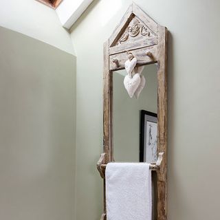 bathroom with mirror and towel