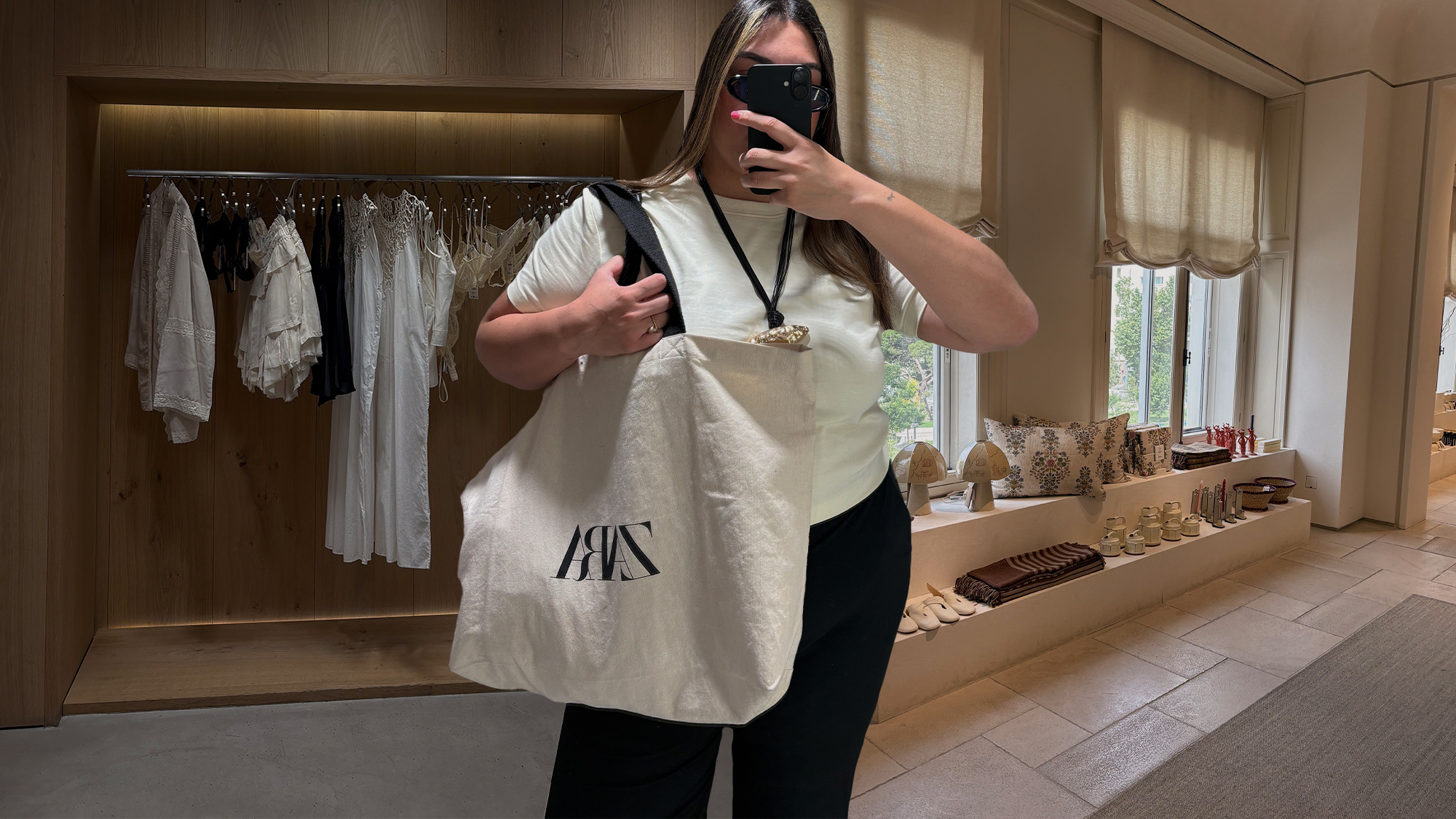 Photos of Who What Wear editor Ana Escalante trying on different Zara summer items in Zara Spain fitting room while visiting Madrid.