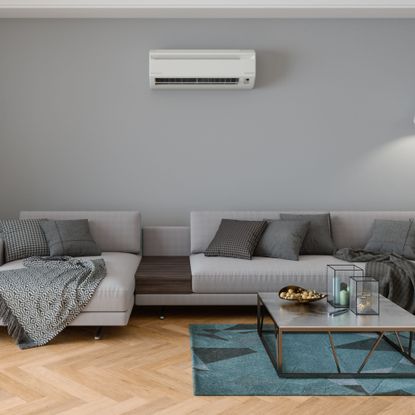 Indoor air conditioning unit installed on the wall in a living room