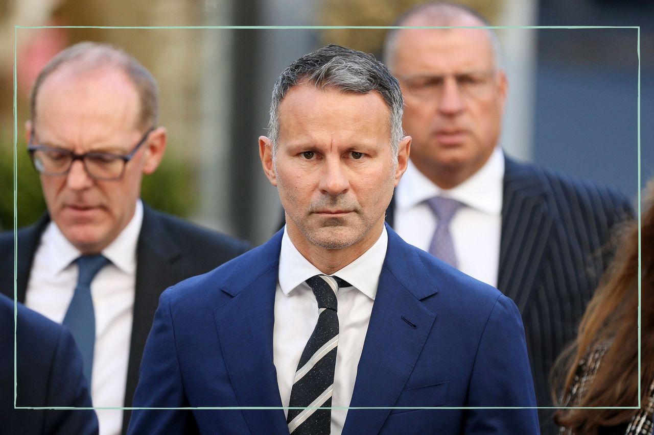 Ryan Giggs in a navy suit looking at the camera