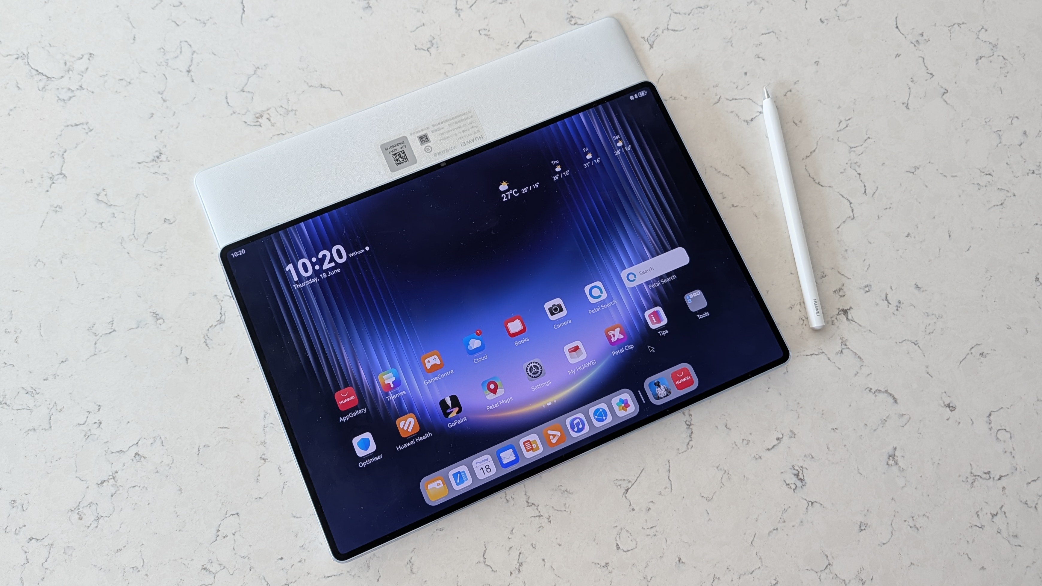 Photos of the Huawei MatePad Pro Max resting on a marble table