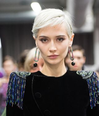 Model wearing big earring at Fashion tour at fashion week women’s at Milan by Giorgio Armani A/W 2020