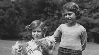 june 1936 queen elizabeth ii as princess elizabeth and her younger sister princess margaret 1930 2002 in the grounds of the royal lodge, windsor princess margaret is holding one of their pet dogs, a cairngorm terrier called chu chu photo by lisa sheridanstudio lisagetty images