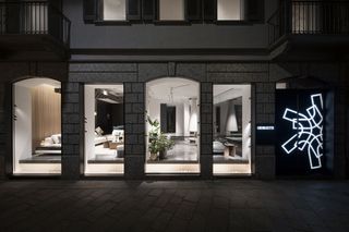 Giorgetti Spiga – The Place view from outside in, at night