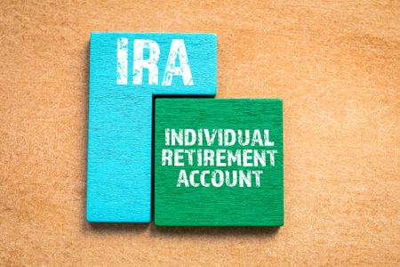 Wood blocks that say IRA and Individual Retirement Account