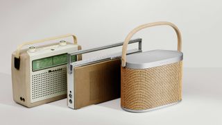 Bang & Olufsen Beosound A5 beside two of B&O's heritage Beolit radios, dating from 1961