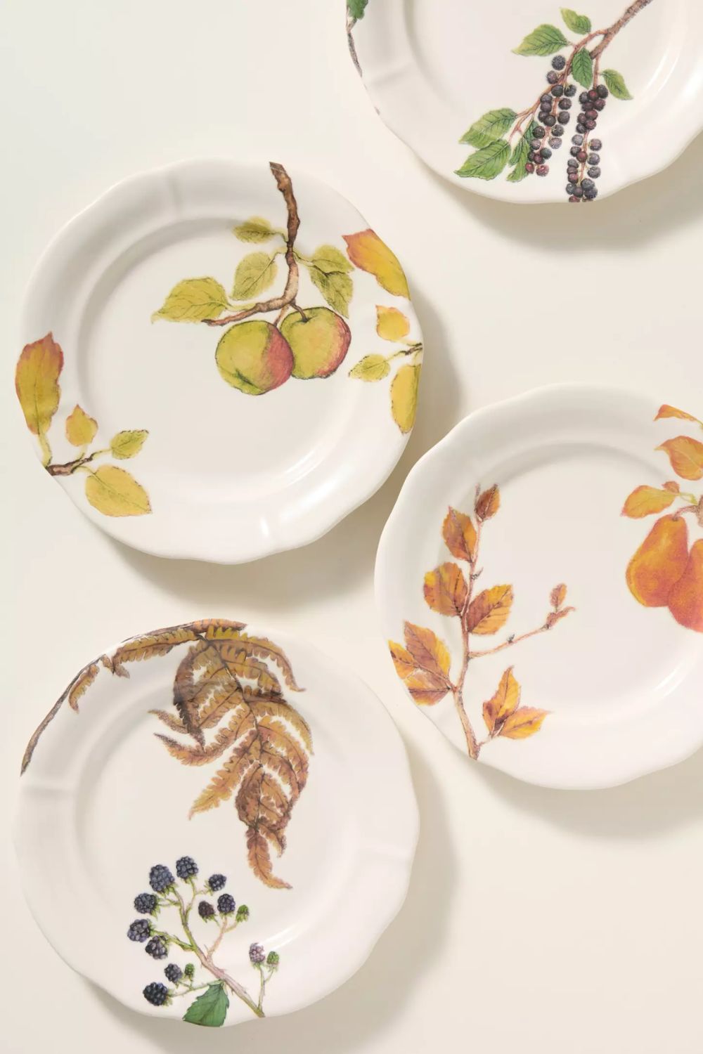 White stoneware dessert plates with harvest motifs