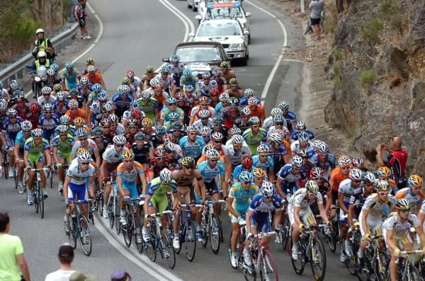 The peloton climb in pursuit of the breakaway