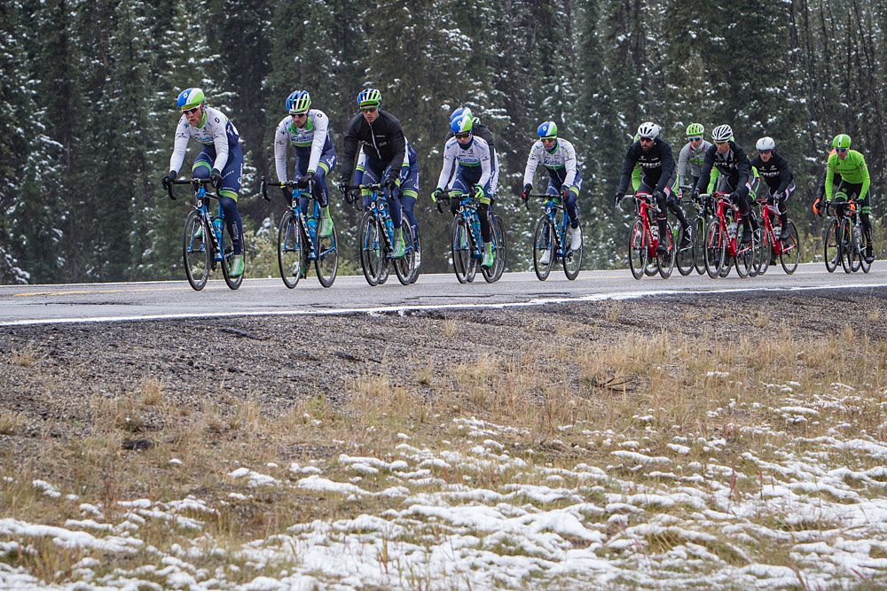The field riders through cold temperatures and rain during stage 3 at the Tour of Alberta