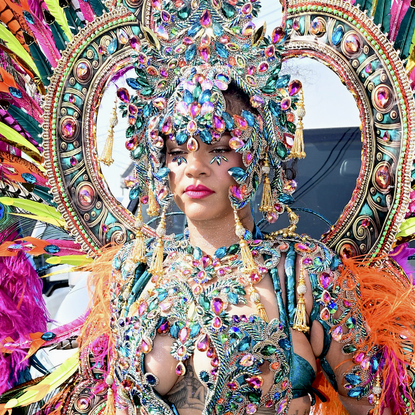 Singer Rihanna gets into the Carnival spirit as she rocks a full carnival costume while attending Grand Kadooment Day in Barbados, partying with her brother's band Aura.