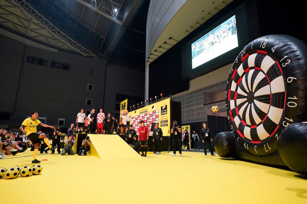 Riders do karate and football-darts before the 2019 Saitama Tour de France criterium