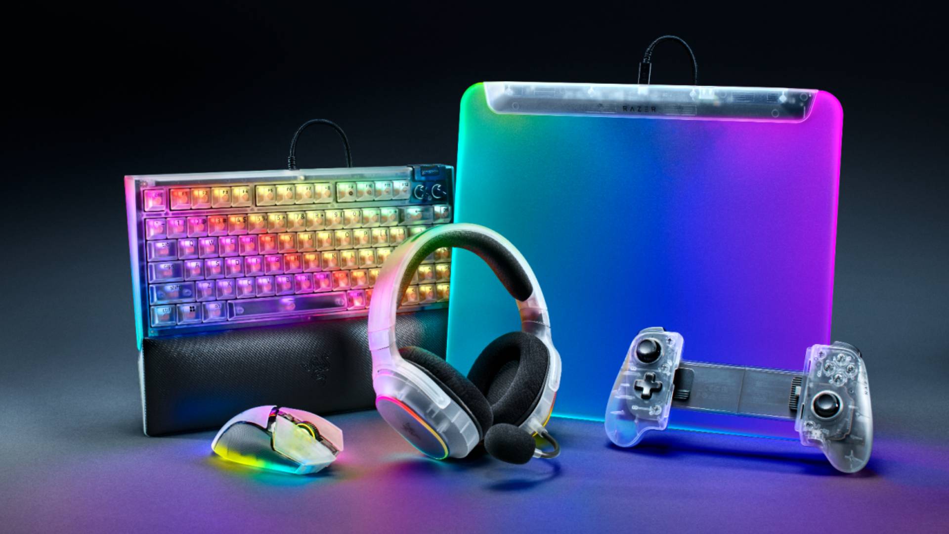 Promo image showing a range of Razer accessories including a mouse, headset, keyboard, mouse mat and mobile controllers with translucent designs.