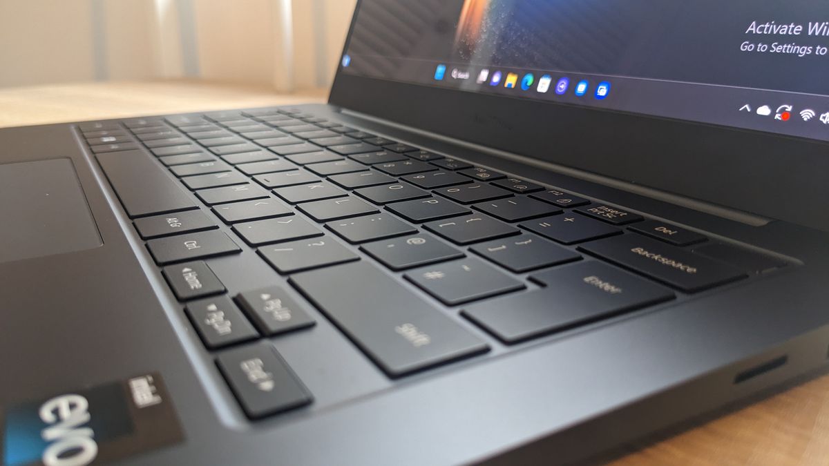 The Samsung Galaxy Book3 Pro 14-inch laptop pictured atop a wooden desk.