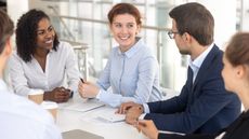 A team of financial advisers have a meeting.