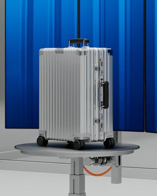Rimowa suitcase with blue wall behind