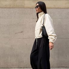 @johannapiispa outfit in white track-inspired jacket and black trousers 
