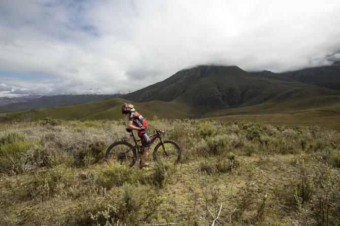 Martin Fanger of BMC Mountainbike Racing stretches his back