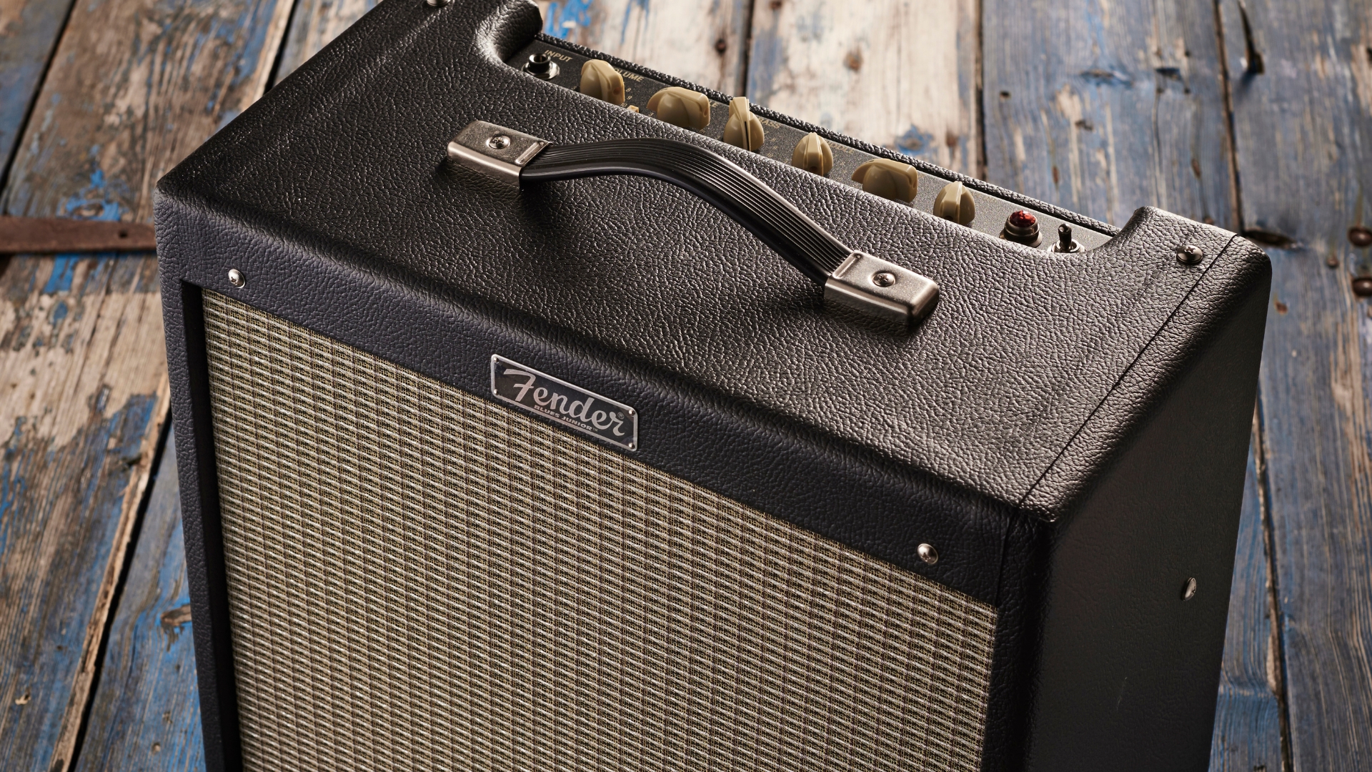 A Fender Blues Junior IV tube amp on a wooden floor