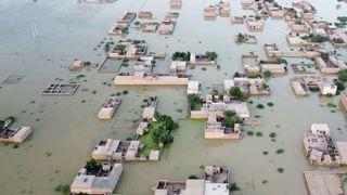 This aerial photograph taken on September 5, 2022 shows flooded residential areas after heavy monsoon rains in Dera Allah Yar, Balochistan province in Pakistan. 