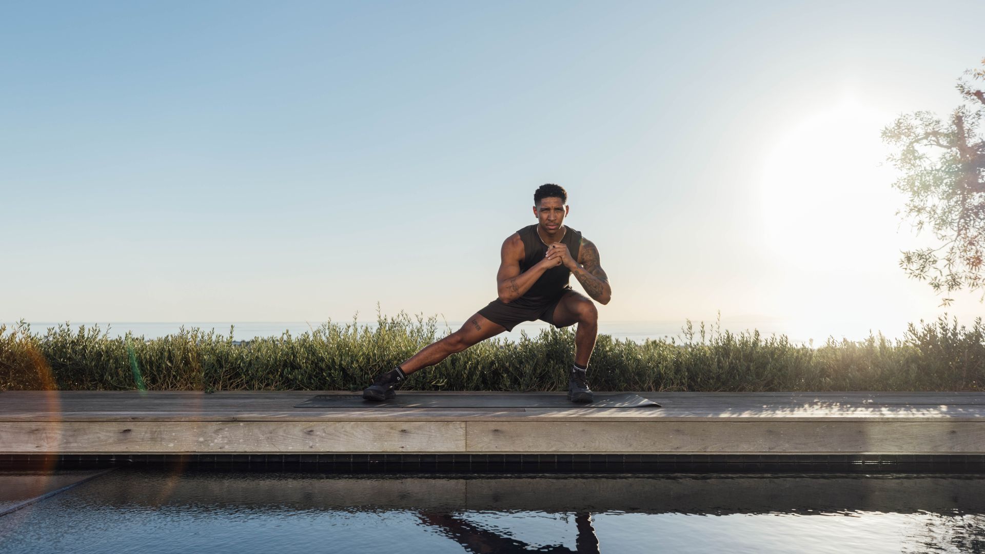 Man demonstrates exercise in gym