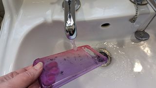 Screenshot showing how to clean a clear phone case - rinse with warm water