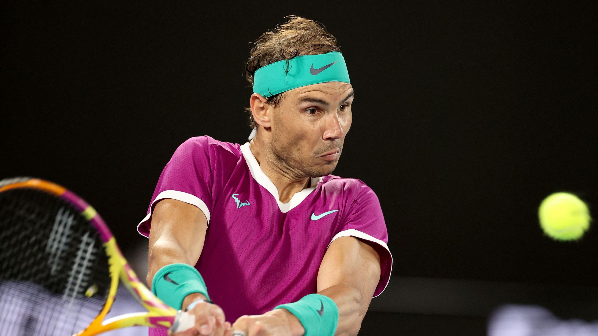 Spain's Rafael Nadal hits a return against Russia's Karen Khachanov during their men's singles match on day five of the Australian Open tennis tournament in Melbourne on January 21, 2022.