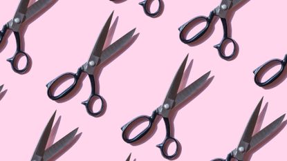 Repeated vintage scissors on pink background