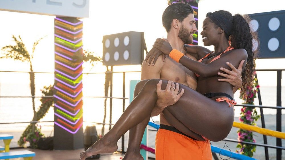 Jack Fowler carrying Justine Ndiba in Love Island Games