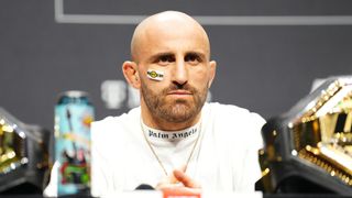 Alexander Volkanovski of Australia is seen on stage during the UFC 290 press conference at T-Mobile Arena on July 06, 2023 in Las Vegas, Nevada. 