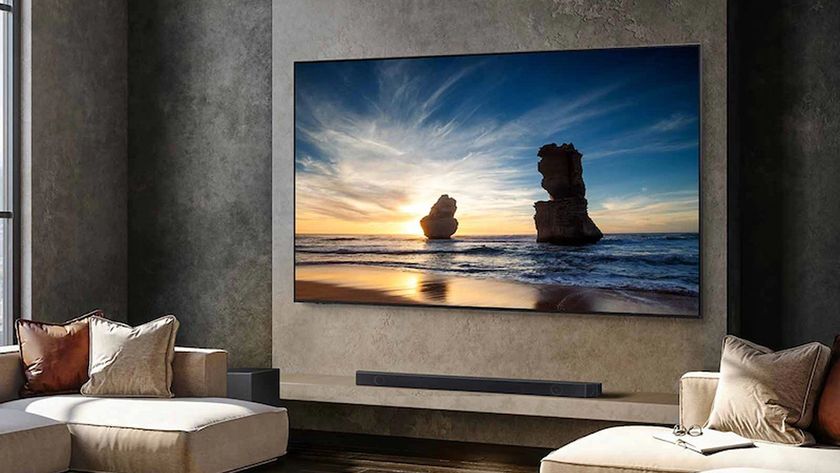 Samsung QN90D lifestyle image with TV wall mounted in modern living room setting