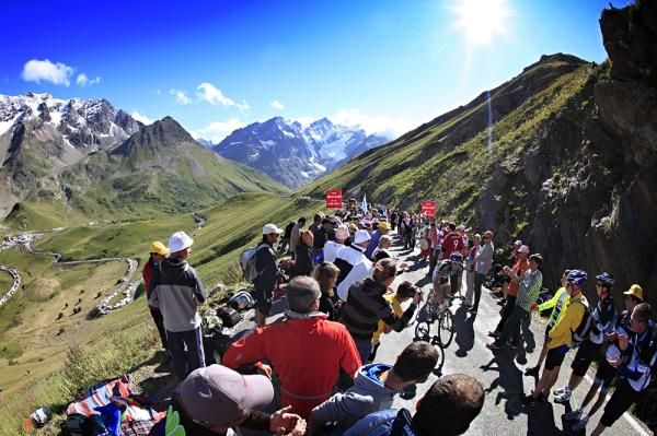 The crowds cheer on the riders as they suffer up the Galibier