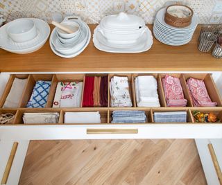 White drawers, wooden handles, wooden dividers