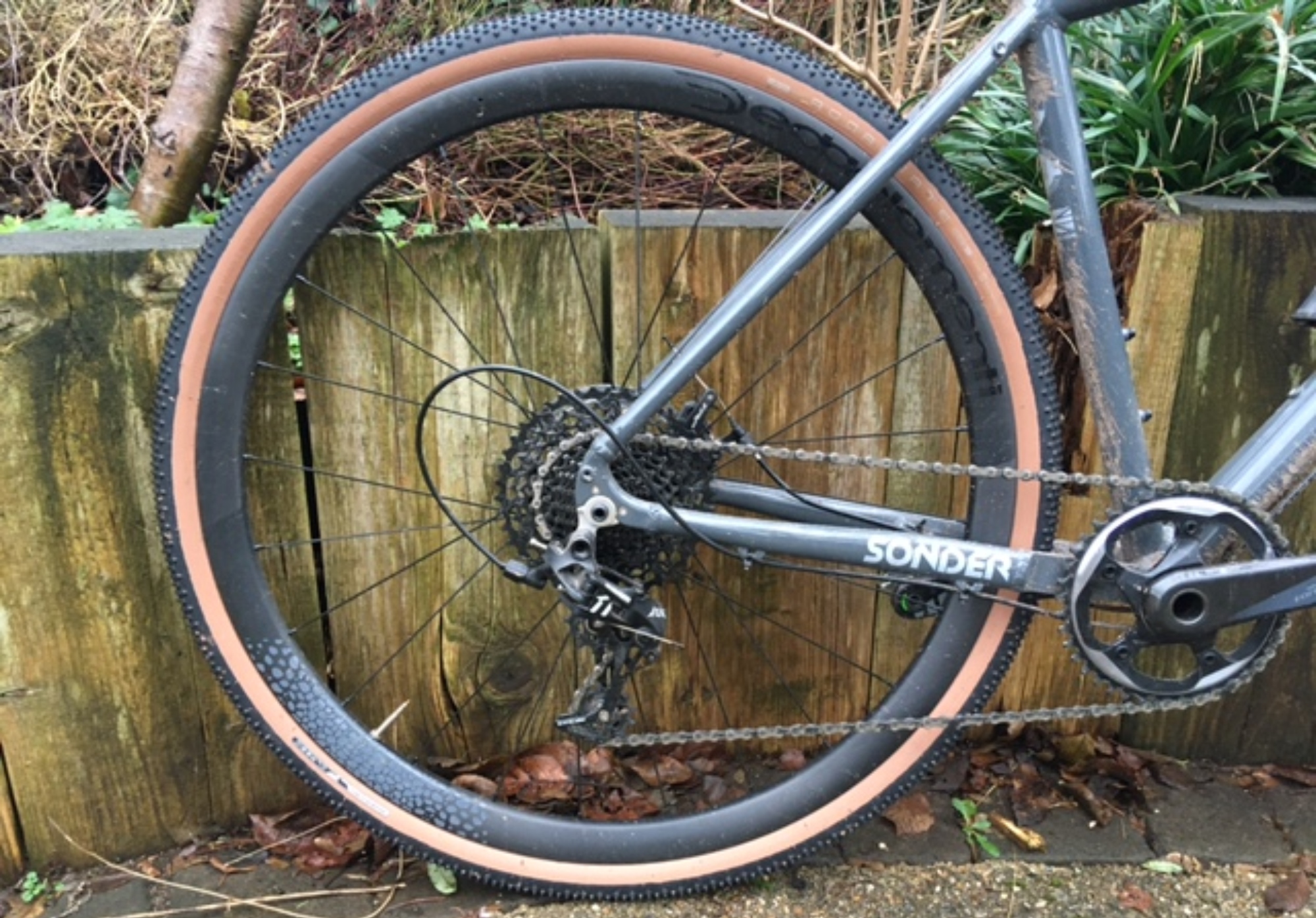 Image shows rear wheel shod with American Classics Aggregate gravel tire