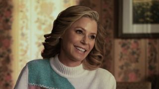 Julie Bowen's Linda Campbell smiling at dinner table in Hysteria! premiere