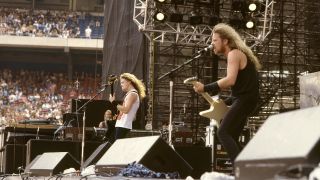 Bassist Jason Newsted and Singer and guitarist James Hetfield of the heavy metal quartet "Metallica" perform onstage at the "Monsters of Rock" festival at Rice Stadium on July 2, 1988 in Houston, Texas.