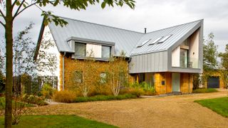 contemporary self build with large driveway and zinc roof