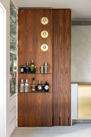 A home bar with sconces used along a wall