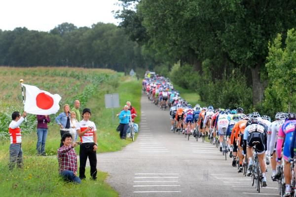 Fans of Japanese champion Fumiyuki Beppu (RadioShack) cheer during stage 1.