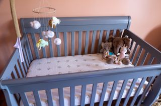 a cot with baby bed safety mechanisms in place