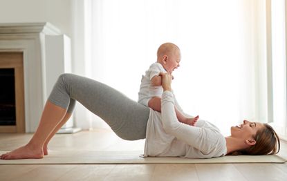A woman with her baby doing a pelvic tilt