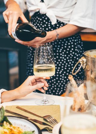 Woman pouring wine