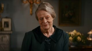 Maggie Smith smiles in her room in Downton Abbey: A New Era.
