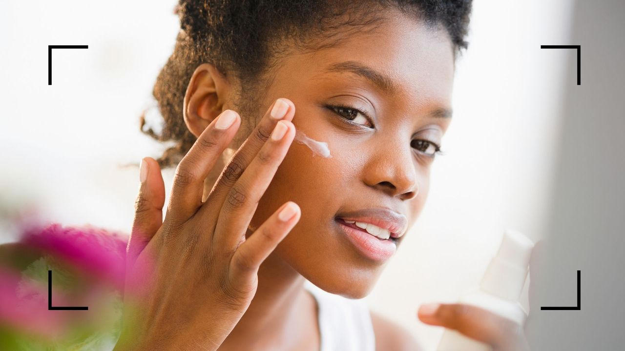 a woman applying sunscreen in winter