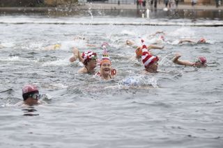 Festive swimmers in Serpentine Lake, Hyde Park