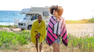Man and woman using camping towels