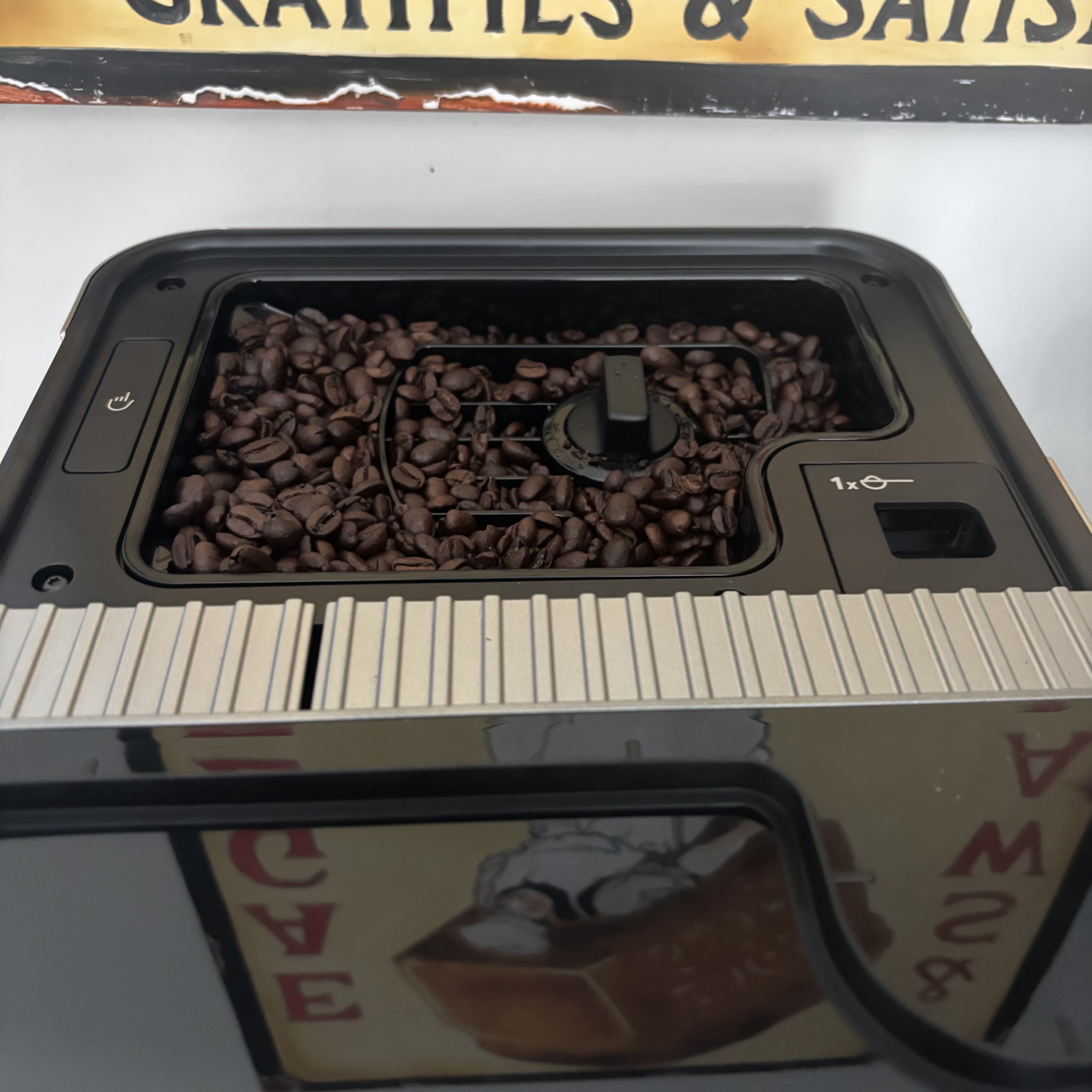 The bean hopper of the KitchenAid Fully Automatic Espresso Machine KF8 filled with beans.