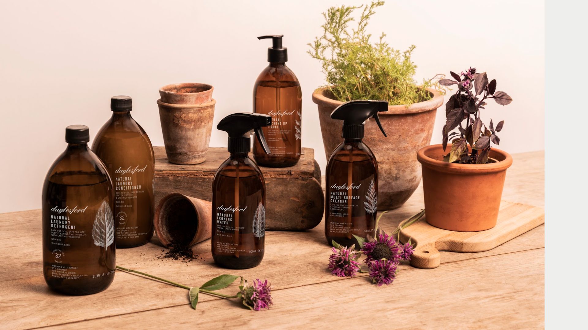 Daylesford cleaning products next to some botanicals