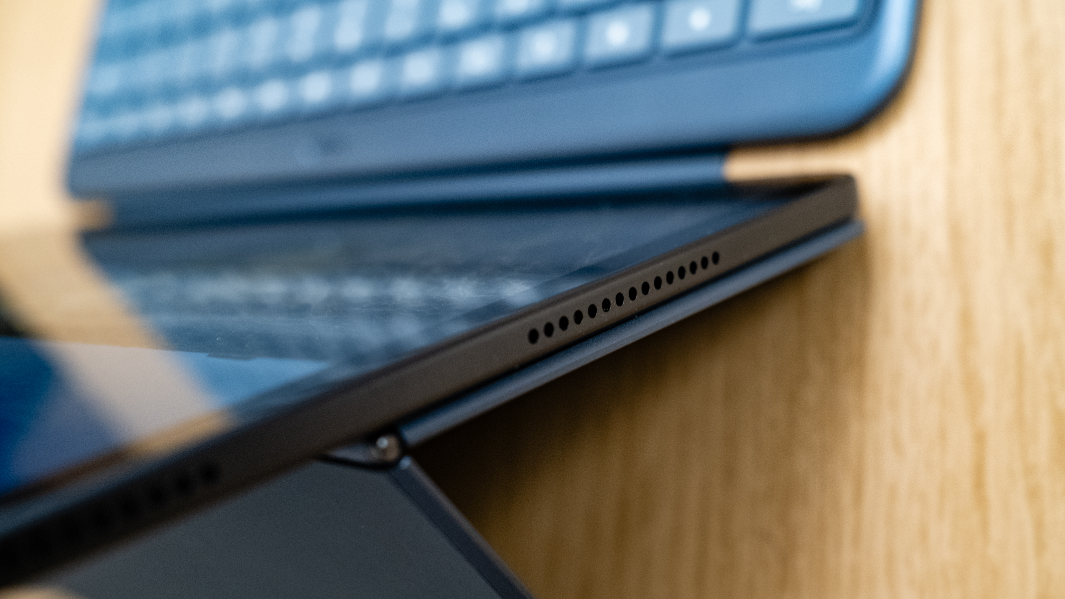 OnePlus Pad 3 speaker detail on a wooden table